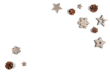 Simple white, winter background. Christmas flat lay concept with pine cones, gold stars and snowflakes. Top view.
