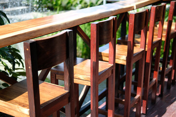 Fototapeta na wymiar wooden chair on terrace in cafe coffee shop restaurant