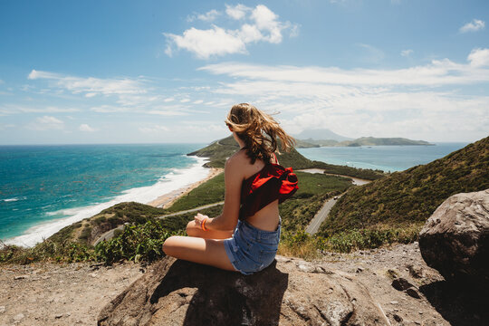 Girl looks out over the Caribbean and Atlantic Ocean stunning views