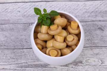 Pickled champignon heap in the bowl
