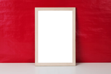 Blank wooden photo frame mockup template on red blackground.