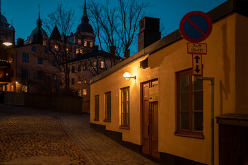 Stockholm, Sweden. Cobbled street in Sodermalm. Color street with cobblestone road, streetlight. Narrow street