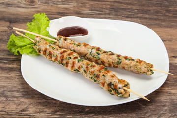 Minced pork skewer kebab with sauce