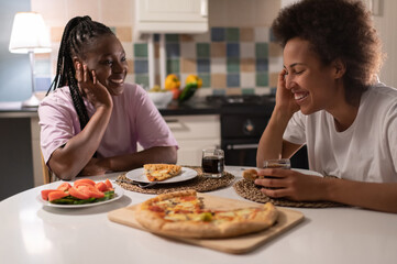 Excited black women during sleepover