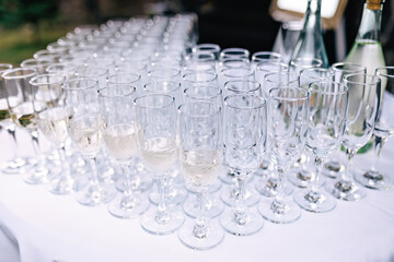 lot of glasses with champagne during on the party table
