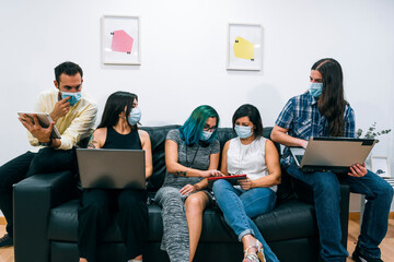 Group of young people during a break in a Coworking office.