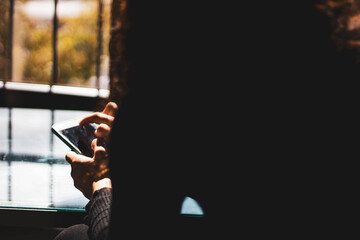 woman hands typing on the mobile