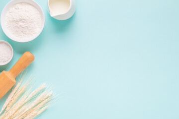 Ingredients for baking on light blue background.