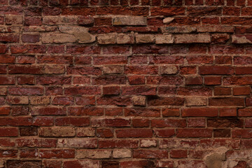 Old crumbling red brick wall