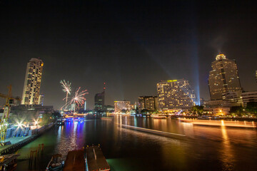 fireworks, Take photos of the night view of the city on New Year's Day with fireworks from a boat in the middle of the river