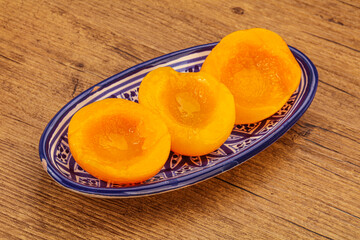Marinated peaches fruit in the bowl