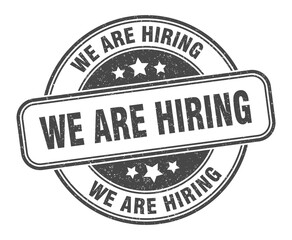 Fototapeta premium we are hiring stamp. we are hiring label. round grunge sign
