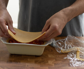 cooking a savory pie, empadao brazilian traditional food