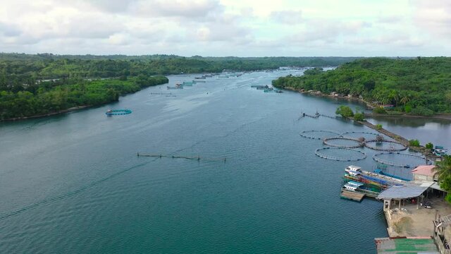 Aerial view of fish ponds for bangus, milkfish. Fish farm, top view. large scale traditional floating fish farms.