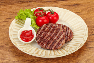 Grilled burger cutlet with sauce
