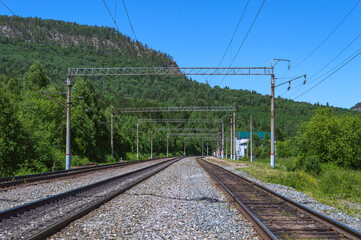 Fototapeta na wymiar Railway and small station in the Ural mountains.