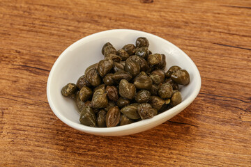 Tasty capers in the bowl