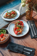 Appetizing bruschetta on a white plate. restaurant server