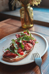 Appetizing bruschetta on a white plate. restaurant server