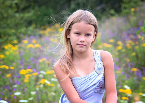 Young Blond Girl in a Field of Flowers