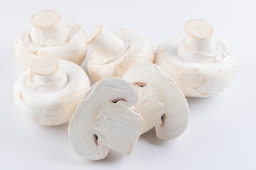 Fototapeta na wymiar Raw fresh white champignons isolated on white background with clipping path