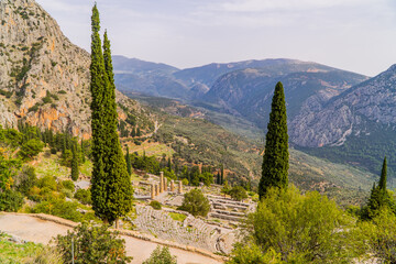 A view of the archaeological site of Ancient Delphi, Greece with the amphitheater and the temple of Apollo