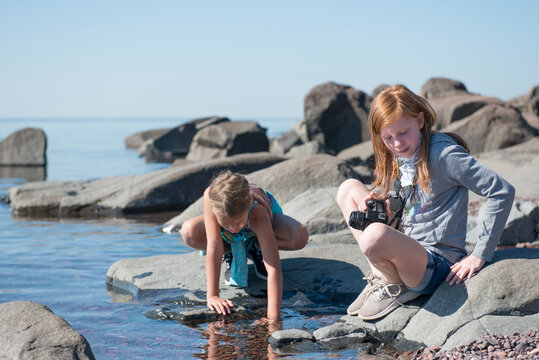 Pre Teen Girls Playing on the Shore