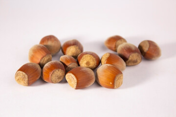 Obraz premium hazelnuts on the table on a white background