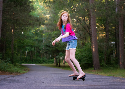 Pre Teen Red Haired Girl Ripsticking