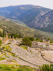 Fototapeta na wymiar Vertical shot of the ancient theater of Delphi, Greece with mountains in the background