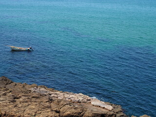 Spectatular turquoise coast of Japan on Sea of Japan in northern Kyoto prefecture on a sunny day with blue sky