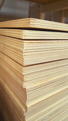 Naklejka premium Sheets of stacked plywood in the warehouse