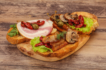 Italian appetizer - bruschetta mix with meat