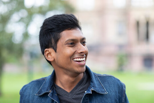 Young Man Laughing Outside In The City