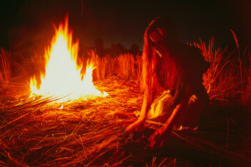 Woman in halloween witch costume divination on the bones