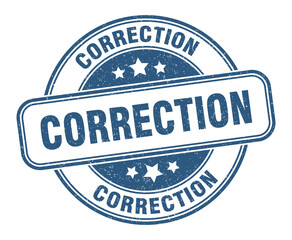 Fototapeta premium correction stamp. correction label. round grunge sign
