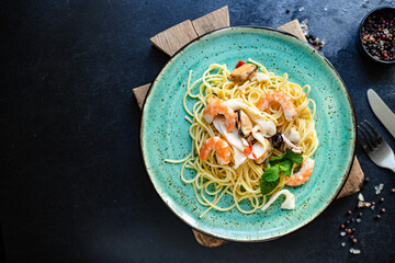 pasta spaghetti seafood shrimp, mussels, squid and more second course healthy meal snack top view copy space for text food background rustic