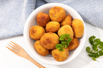 Homemade croquettes in a ceramic bowl. Typical spanish appetizer