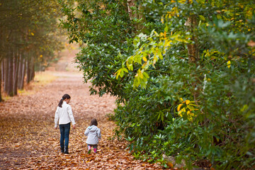 two young girls walking in the forrest close to Woking