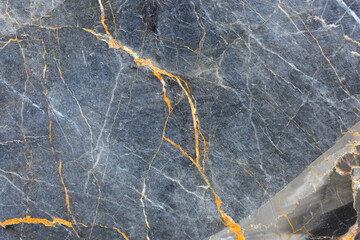 Yellow Patterned natural of dark gray marble pattern (Russia Gold) background texture for design.