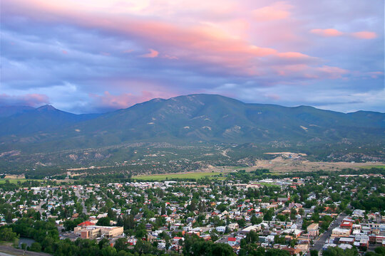 Salida Colorado Overlook - Aerial view of Salida Colorado, with beautiful pink sunset cloud overhead and mountain range in background. Chaffee County.