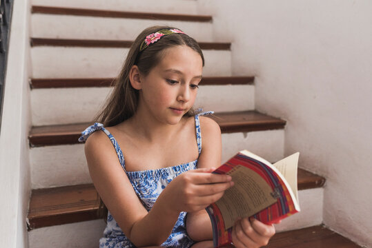 Cute Little Girl Reading A Story