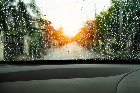 poor vision rain drops on car glass in rainy days