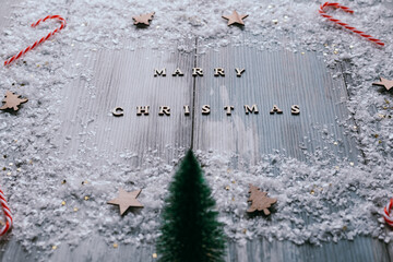 Christmas decoration on rustic wooden background with Marry Christmas text, low angle of view