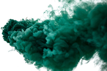 Green smoke bomb exploding against white background