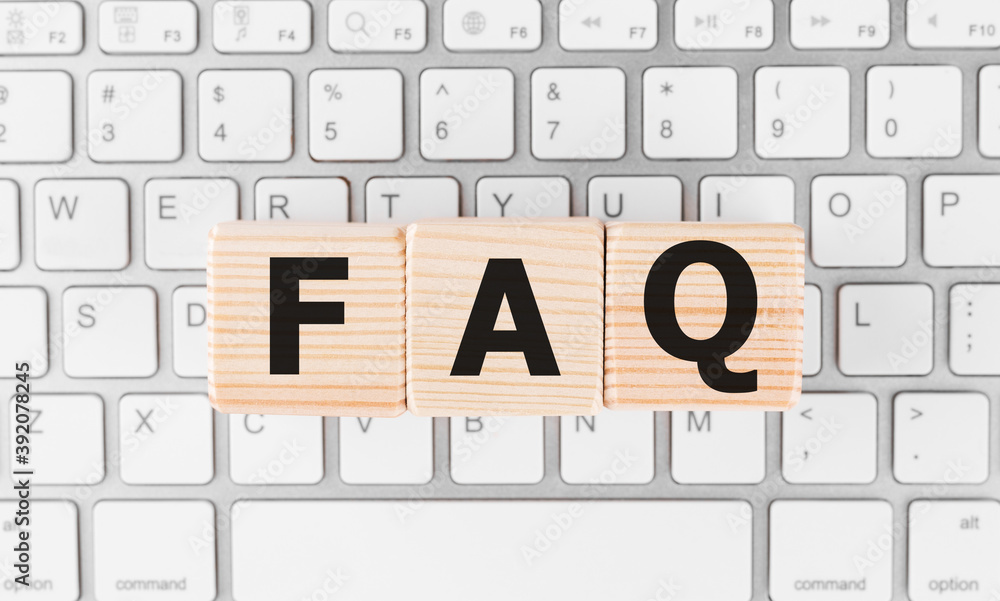 Poster faq on black block with keyboard background.