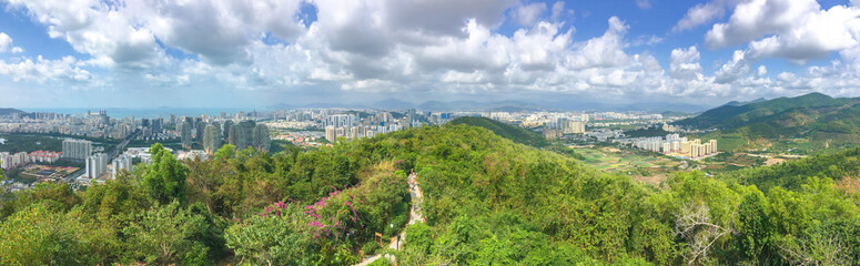 Panoramic view on a sunny day from the observation deck of the city of Sanya on the tropical island of Hainan in China