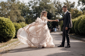 portrait of a happy bride in luxury dress and groom, wedding love emotions