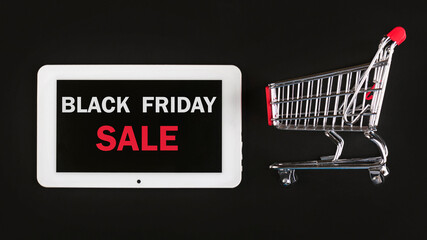 Black friday.Digital tablet with text and shopping cart.Shopping concept