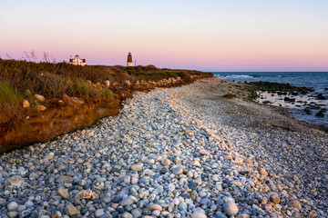 Point Judith Lighthouse under dramatic sky.